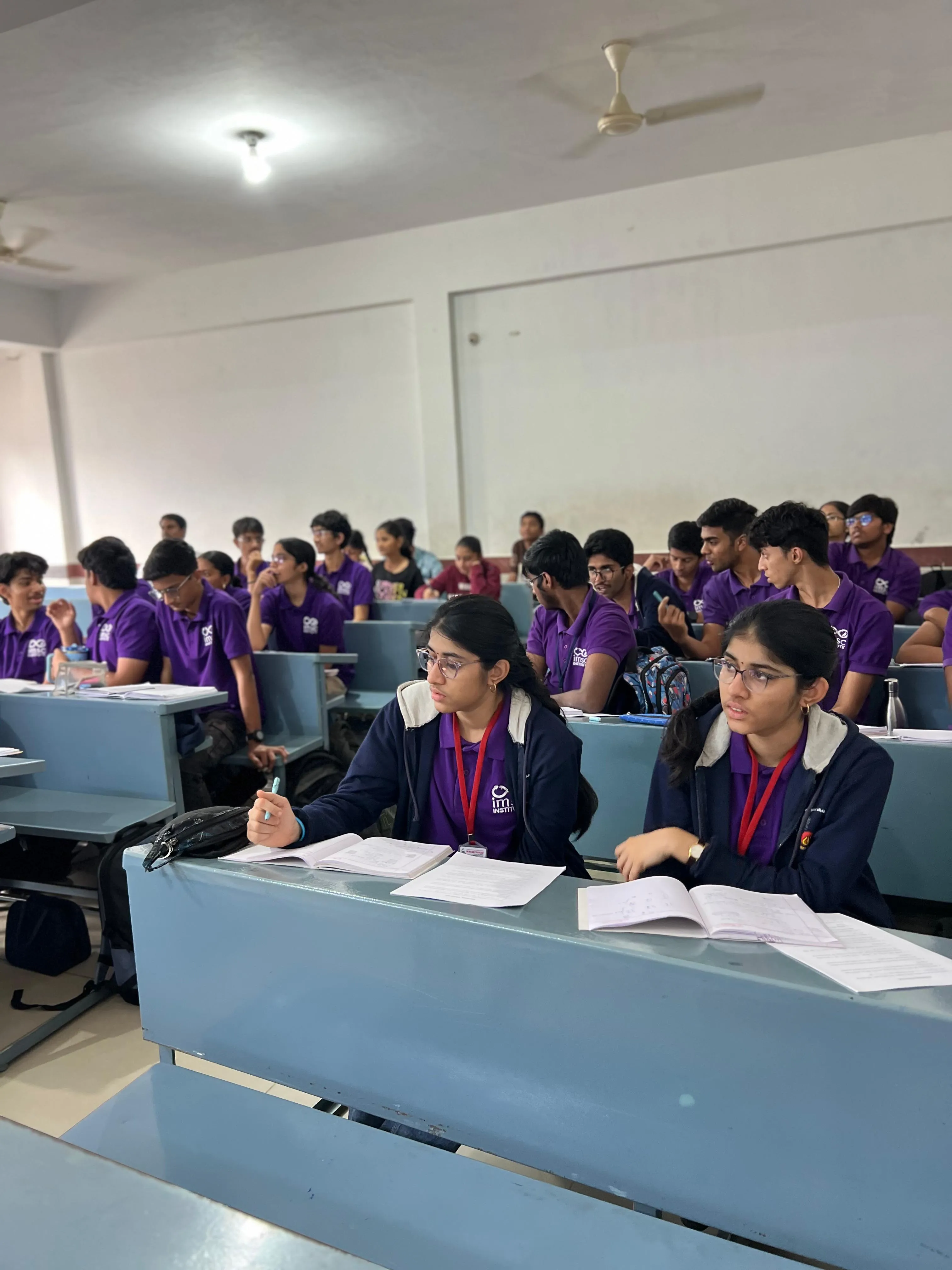 Students taking notes in class at IMSC